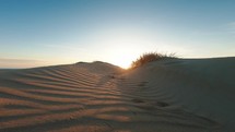 Over sandy Dunes at sunset 
