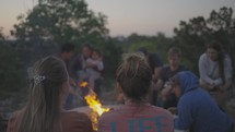 roasting marshmallows around a campfire 