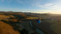 Flying above spring nature, Paragliding adrenaline adventure freedom Follow action camera
