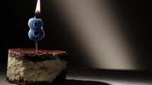 Candle eight in tiramisu cake