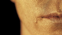 Macro View Of man's Face Part With Beautiful Golden Body Art Lips