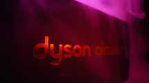 February 2024 - Prague, Czechia. Dyson Airwrap brand logo in neon and smoke. Popular multi-styler with various attachments. High quality 4k footage