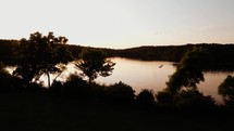 People on the lake after sunset