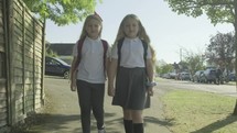 girls walking home from school 