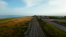 Flying on railway line at sunset 