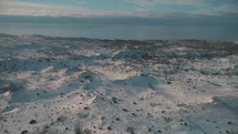 aerial view over a snow covered landscape 