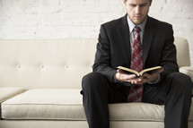 businessman reading a Bible 