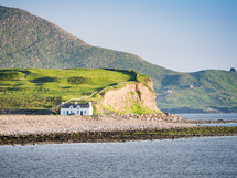 house on a rocky coastal shore 