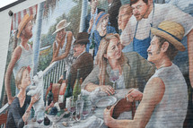street art painting of outdoor diners 