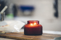Warm glow of a candle in the kitchen