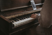 a girl playing a piano 