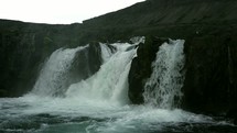 water flowing over a waterfall in Iceland 