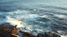 waves washing onto a rocky shore 
