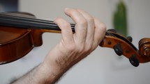 a man playing a violin 