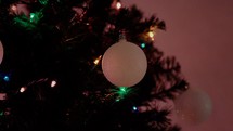 Christmas ornament and Christmas lights on a tree