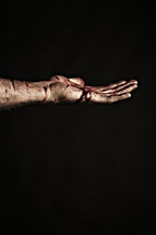 Jesus' bloody hand after the crucifixion