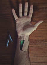 batteries in a man's arm 