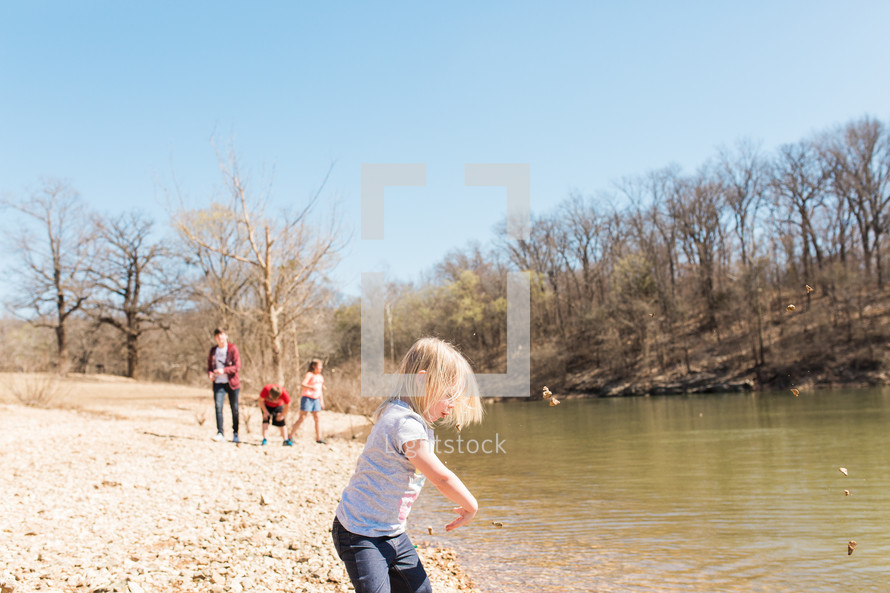 kids playing on a riverbank 