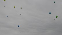 releasing helium balloons into the heavens 