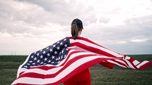 Patriot woman with american USA waving flag