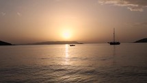 Fisher boat passing by during sunset