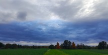 rural farmland under a cloudy sky 