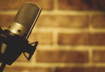 microphone and brick wall