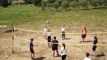 teens playing volley ball 