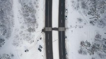 Aerial drone view of road in idyllic winter landscape. 