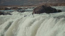 rushing water over a waterfall 
