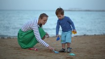 Mother and son playing on the beach