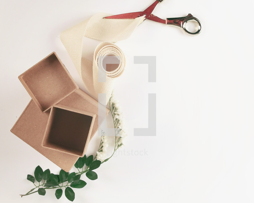 boxes, scissors, ribbon, on white 