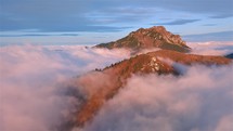 Aerial view of misty alps mountains in autumn nature. Freedom outdoor travel tourism
