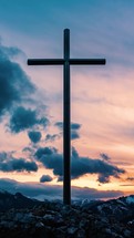 Vertical video of Clouds moving fast over religious cross in peaceful evening nature, christian symbol of religion and faith timelapse

