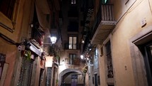 Cityscape of ancient apartment buildings with balconies in old part of Barcelona - Gothic Quarter, Born district. Steadicam shot of walking person. Popular travel destination. High quality 4k footage
