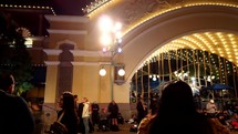 crowds of people at Disneyland at night 