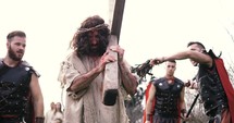 Roman Soldiers and Jesus carrying the Cross 