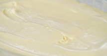 Macro slow motion of mango sorbet ice cream with scoop