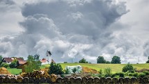 building storm clouds over a rural landscape 