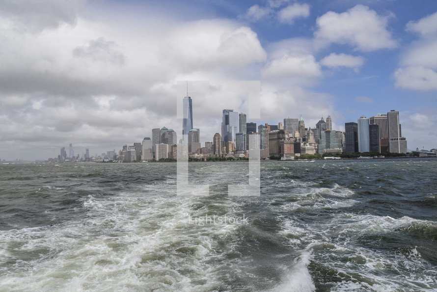 distant New York City skyline from the water 
