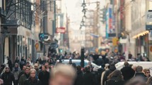 pedestrians on a crowded city sidewalk 