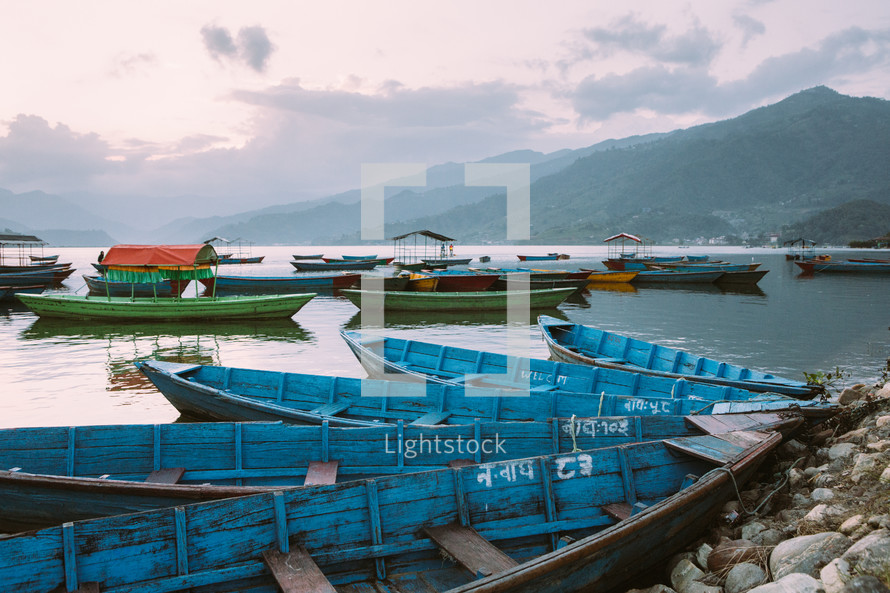 boats floating in a bay in Pokhara 