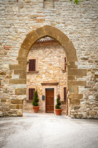 old arched stone entrance in Italy 