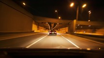 Interior point of view timelapse of a car driving at night themes of driving personal perspective
