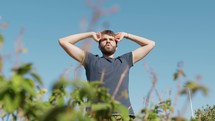 Young Man Opens And Closes His Elbows For Gym In The Park