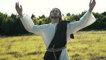 Jesus with arms raised 