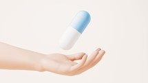 Loop animation of medical pill in a hand, 3d rendering.
