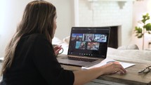 a woman working from home on a video conference 