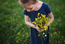 a girl picking flowers 