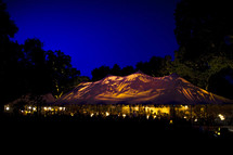 wedding reception tent canvas at dusk blue hour party event celebration 
